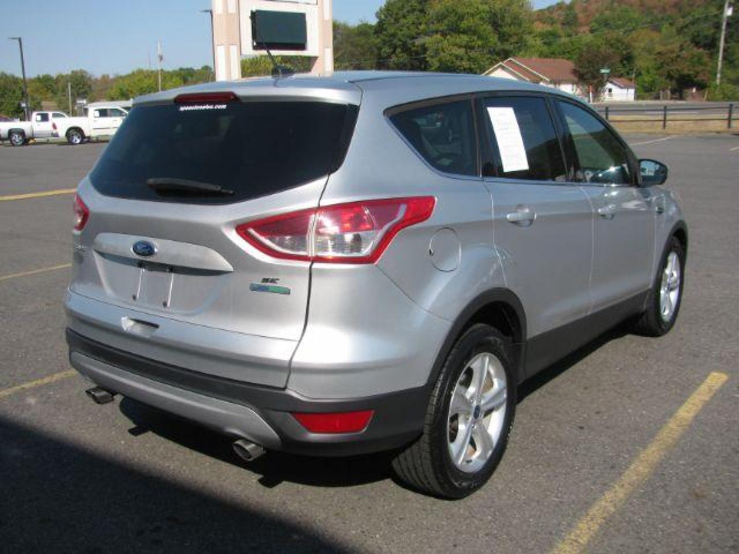 2014 Silver Ford Escape SE FWD (1FMCU0GX0EU) with an 1.6L L4 DOHC 16V engine, 6-Speed Automatic transmission, located at 2443 Albert Pike, Hot Springs, AR, 71913, (501) 623-6255, 34.492222, -93.109993 - Photo#2