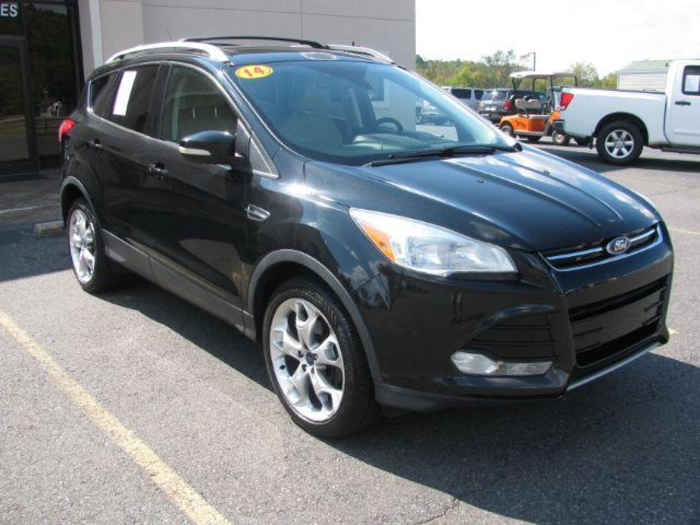 2014 Black Ford Escape Titanium FWD (1FMCU0JX0EU) with an 1.6L L4 DOHC 16V engine, 6-Speed Automatic transmission, located at 2443 Albert Pike, Hot Springs, AR, 71913, (501) 623-6255, 34.492222, -93.109993 - Photo#0