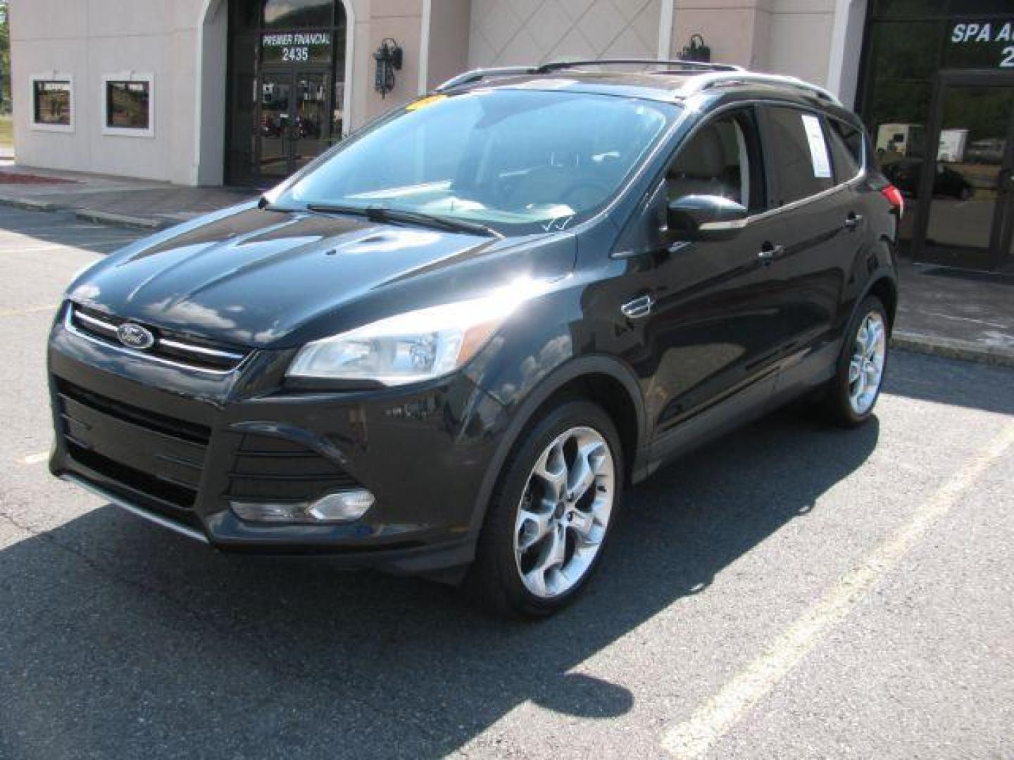 2014 Black Ford Escape Titanium FWD (1FMCU0JX0EU) with an 1.6L L4 DOHC 16V engine, 6-Speed Automatic transmission, located at 2443 Albert Pike, Hot Springs, AR, 71913, (501) 623-6255, 34.492222, -93.109993 - Photo#5