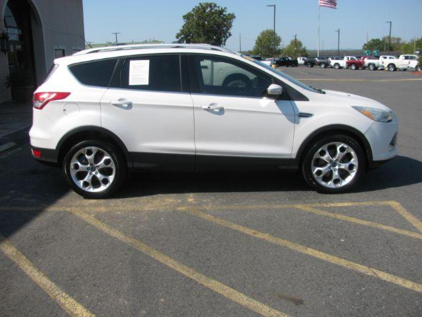 2014 White Ford Escape Titanium FWD (1FMCU0J96EU) with an 2.0L L4 DOHC 16V engine, 6-Speed Automatic transmission, located at 2443 Albert Pike, Hot Springs, AR, 71913, (501) 623-6255, 34.492222, -93.109993 - Photo#1