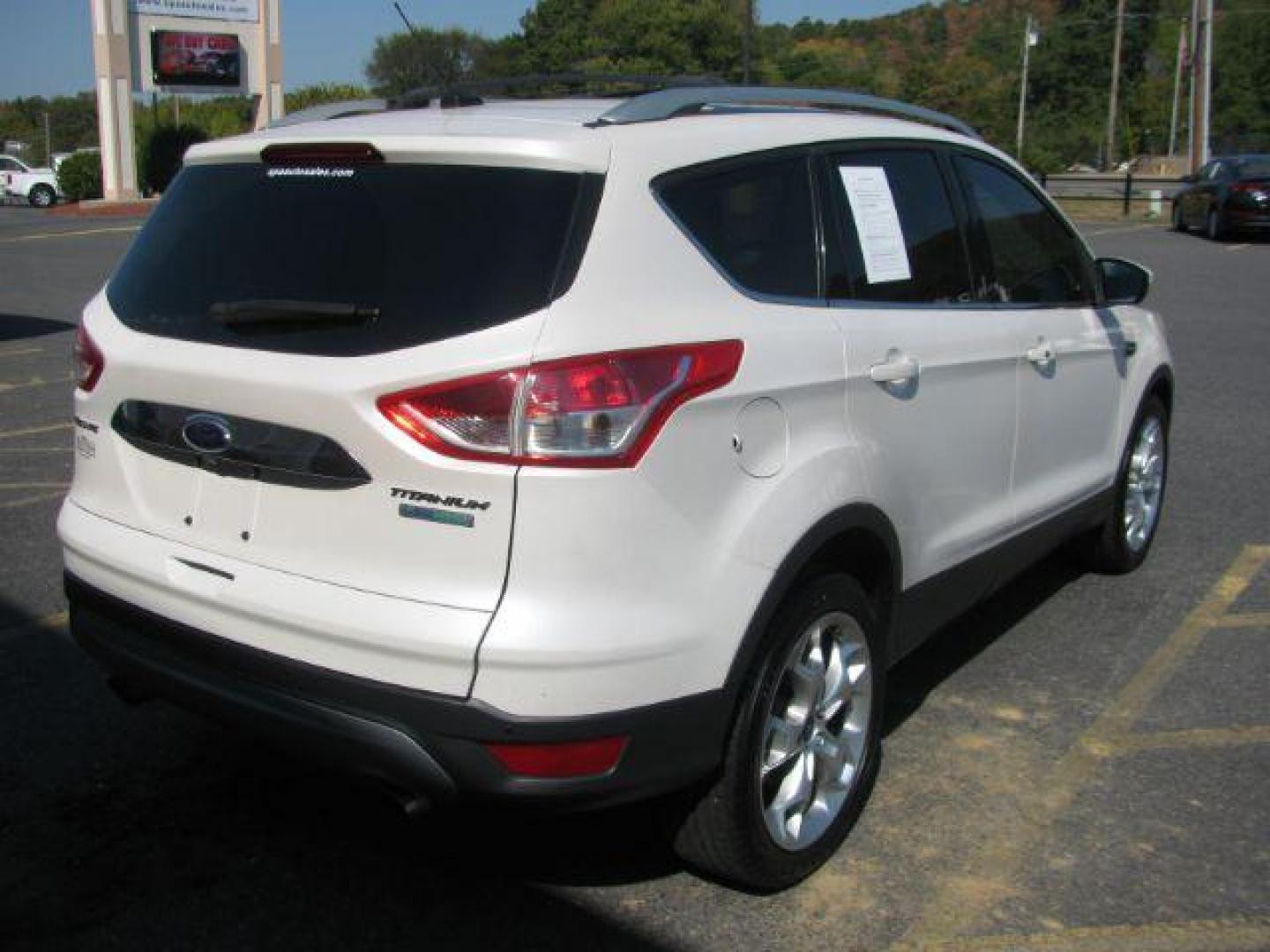 2014 White Ford Escape Titanium FWD (1FMCU0J96EU) with an 2.0L L4 DOHC 16V engine, 6-Speed Automatic transmission, located at 2443 Albert Pike, Hot Springs, AR, 71913, (501) 623-6255, 34.492222, -93.109993 - Photo#2