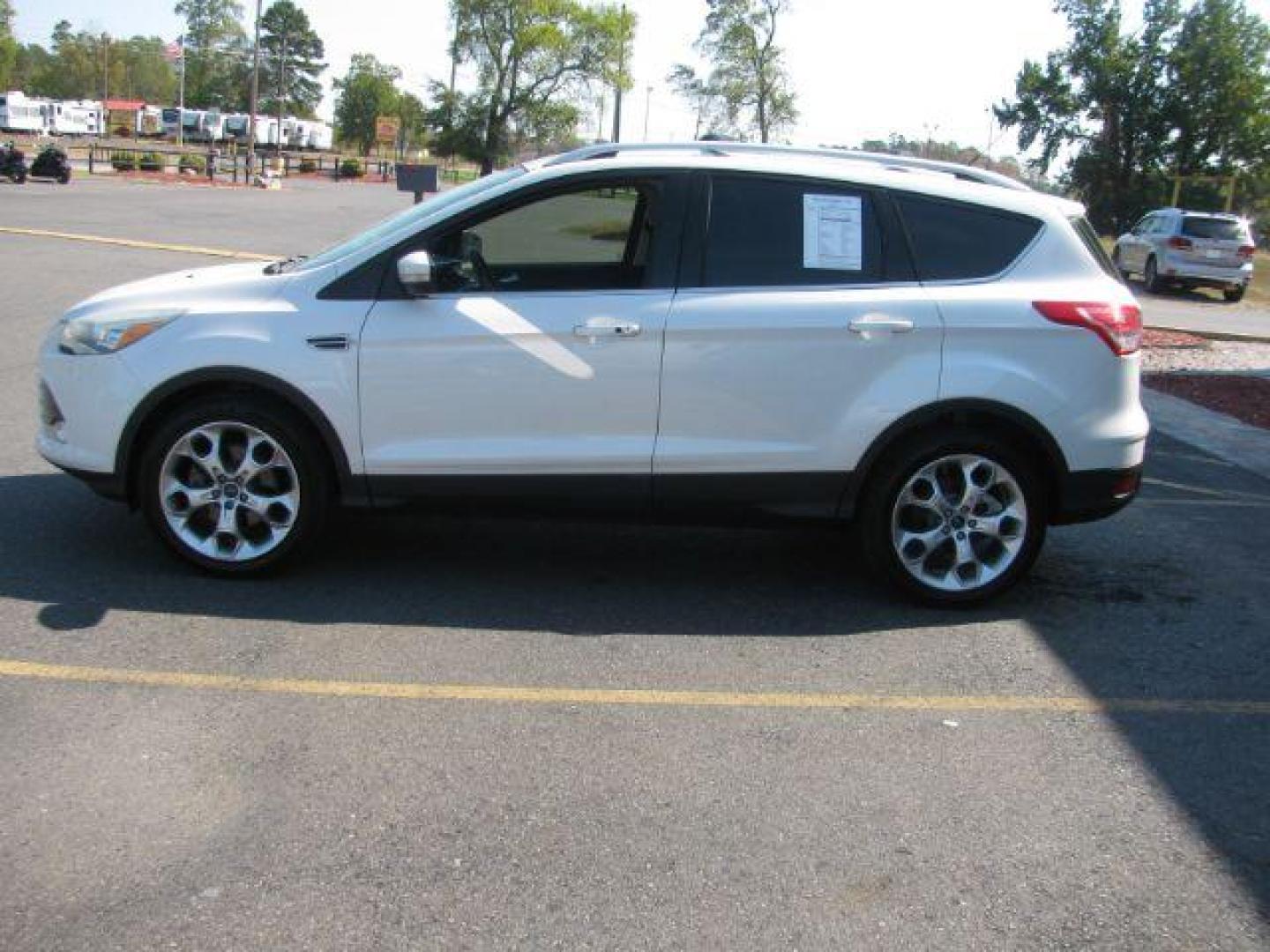 2014 White Ford Escape Titanium FWD (1FMCU0J96EU) with an 2.0L L4 DOHC 16V engine, 6-Speed Automatic transmission, located at 2443 Albert Pike, Hot Springs, AR, 71913, (501) 623-6255, 34.492222, -93.109993 - Photo#4