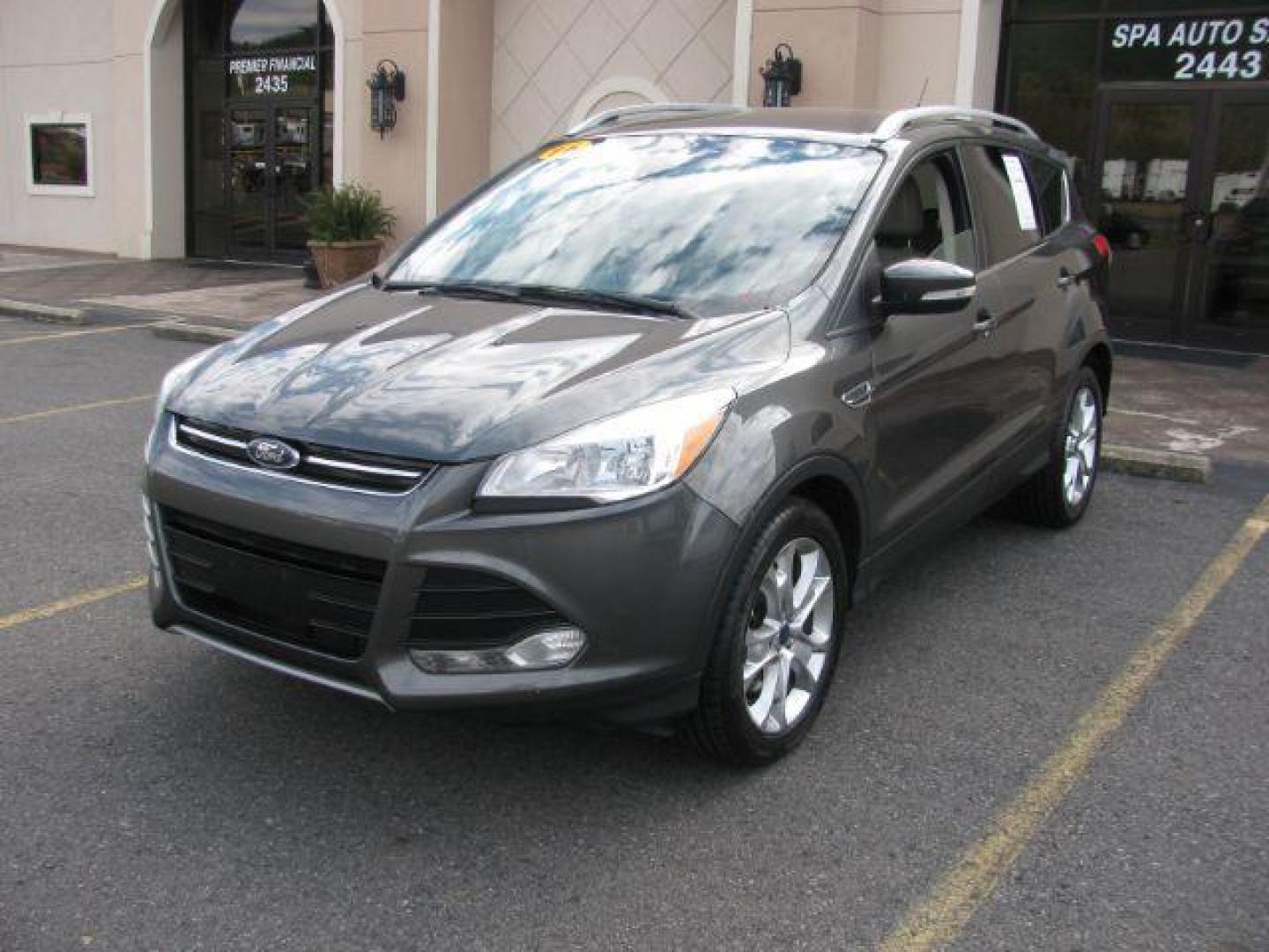 2016 Gray Ford Escape Titanium FWD (1FMCU0J99GU) with an 2.0L L4 DOHC 16V engine, 6-Speed Automatic transmission, located at 2443 Albert Pike, Hot Springs, AR, 71913, (501) 623-6255, 34.492222, -93.109993 - Photo#0