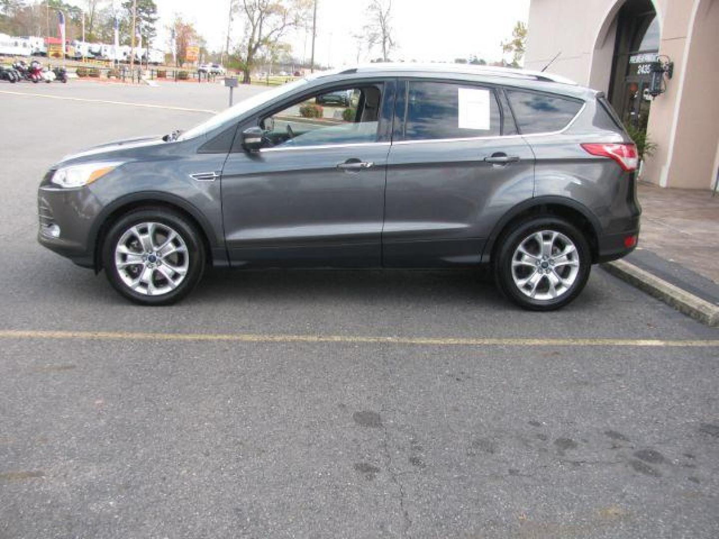 2016 Gray Ford Escape Titanium FWD (1FMCU0J99GU) with an 2.0L L4 DOHC 16V engine, 6-Speed Automatic transmission, located at 2443 Albert Pike, Hot Springs, AR, 71913, (501) 623-6255, 34.492222, -93.109993 - Photo#1