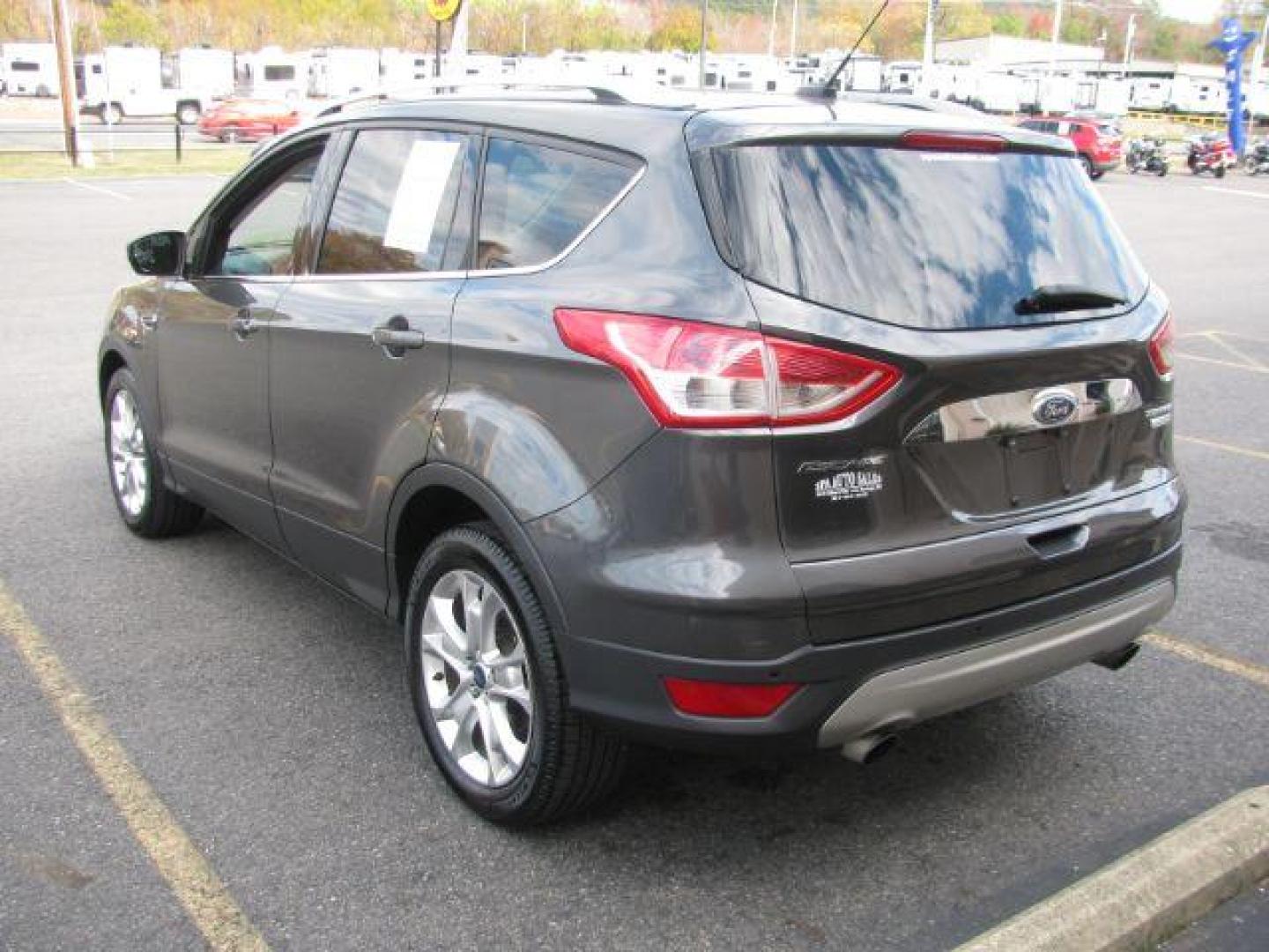 2016 Gray Ford Escape Titanium FWD (1FMCU0J99GU) with an 2.0L L4 DOHC 16V engine, 6-Speed Automatic transmission, located at 2443 Albert Pike, Hot Springs, AR, 71913, (501) 623-6255, 34.492222, -93.109993 - Photo#2