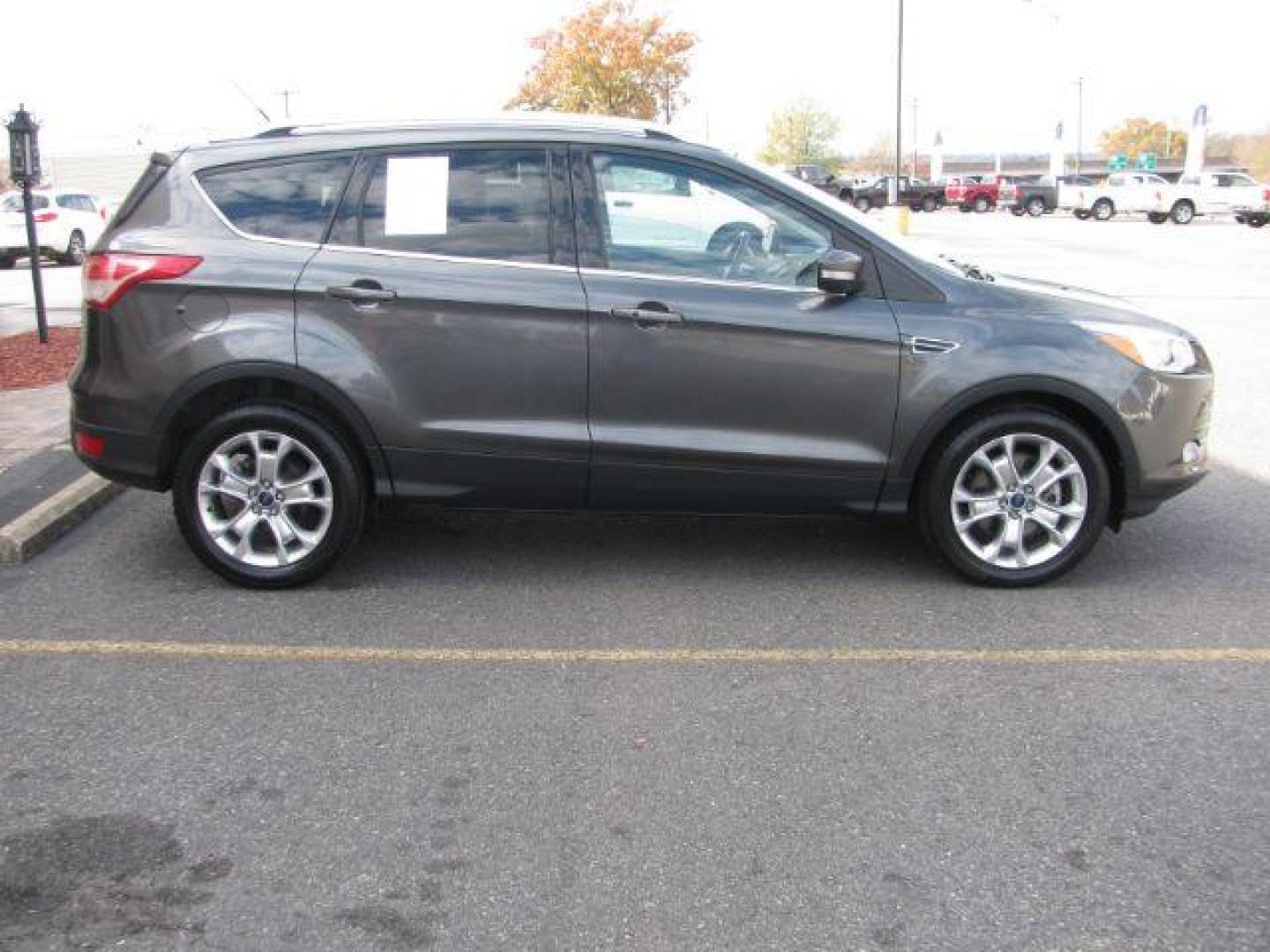 2016 Gray Ford Escape Titanium FWD (1FMCU0J99GU) with an 2.0L L4 DOHC 16V engine, 6-Speed Automatic transmission, located at 2443 Albert Pike, Hot Springs, AR, 71913, (501) 623-6255, 34.492222, -93.109993 - Photo#4