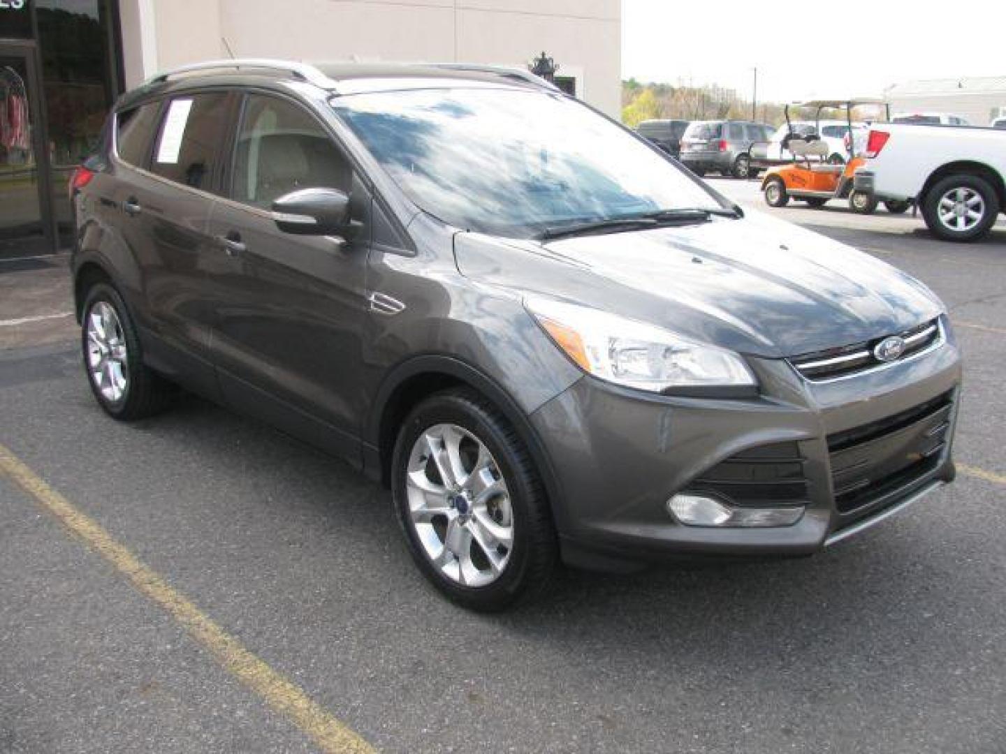 2016 Gray Ford Escape Titanium FWD (1FMCU0J99GU) with an 2.0L L4 DOHC 16V engine, 6-Speed Automatic transmission, located at 2443 Albert Pike, Hot Springs, AR, 71913, (501) 623-6255, 34.492222, -93.109993 - Photo#5