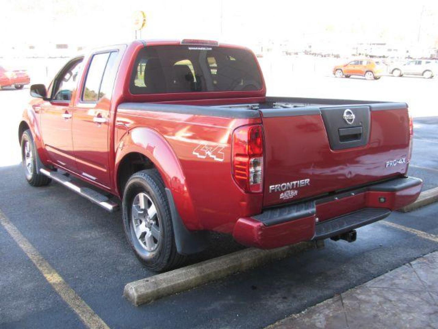 2012 Red Nissan Frontier PRO-4X Crew Cab 4WD (1N6AD0EV9CC) with an 4.0L V6 DOHC 24V engine, 5-Speed Automatic transmission, located at 2443 Albert Pike, Hot Springs, AR, 71913, (501) 623-6255, 34.492222, -93.109993 - Photo#2